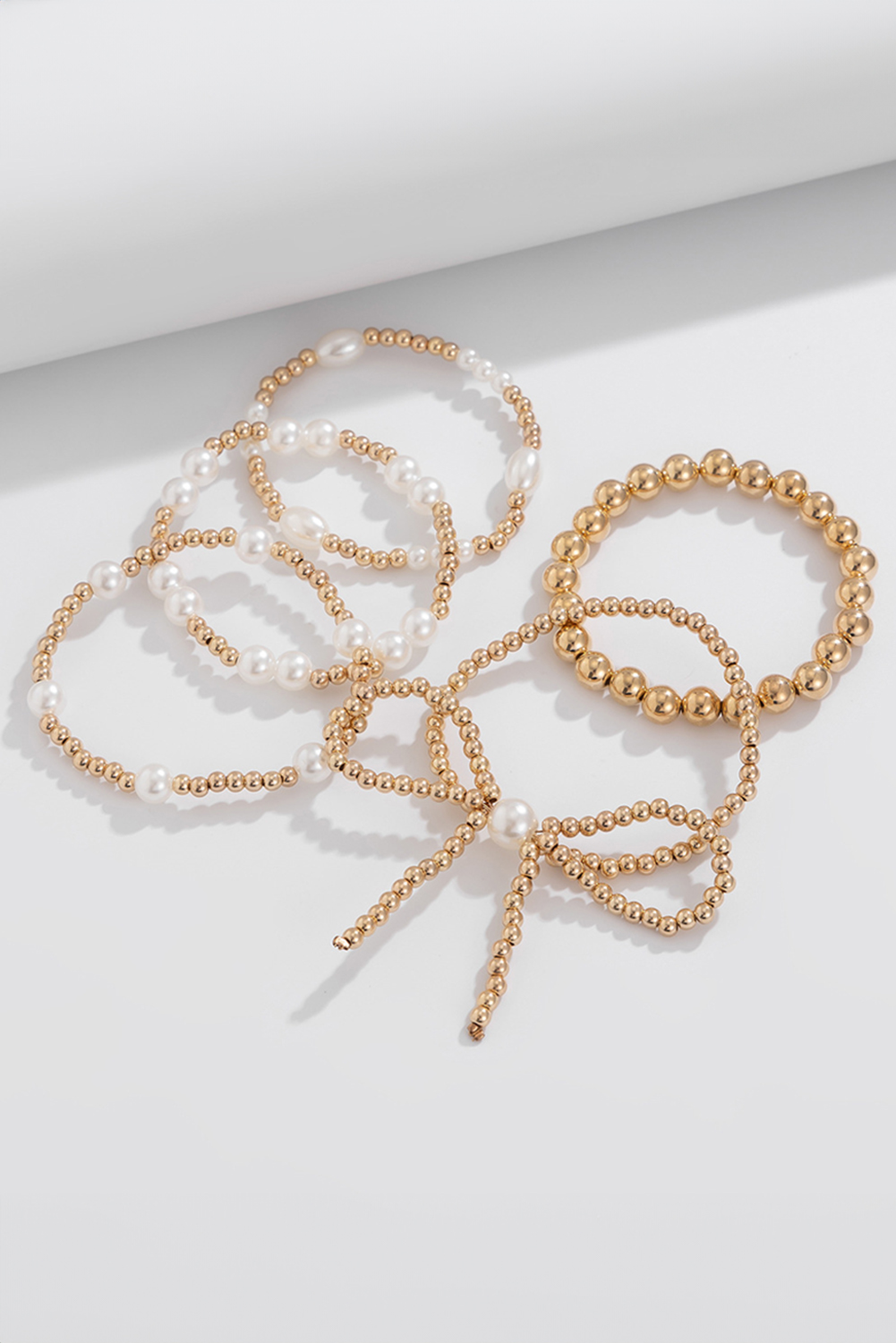 Gold Bow Knot Pearl Beaded Multi Layered Bracelet Set - Image 4